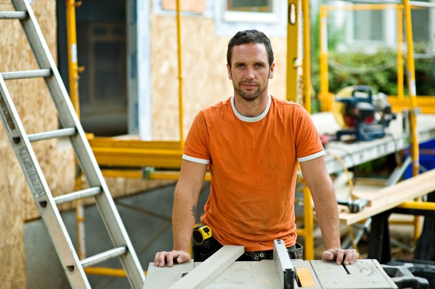 Contractor in orange shirt on remodel job site