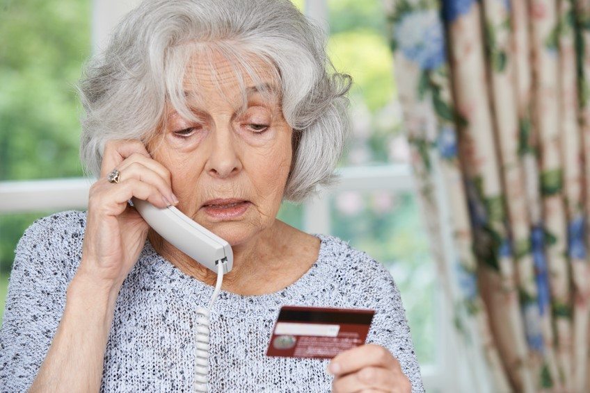 COVID-19 scams targeting senior woman about to give her credit card info over the phone