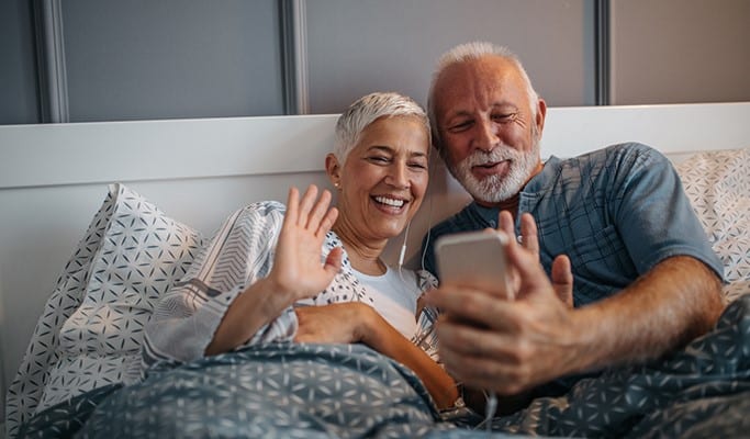 senior couple on video call with family