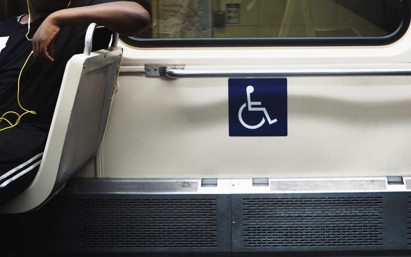 Focus on handicapped sign inside public transportation