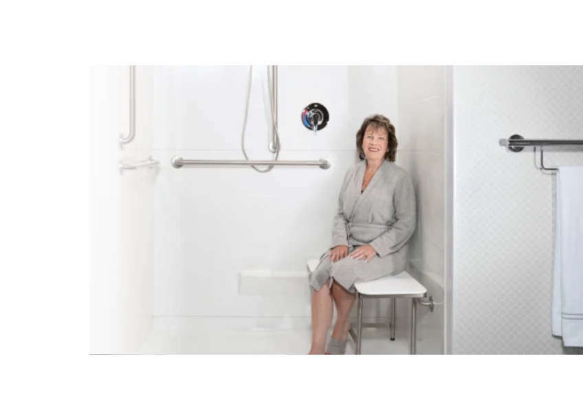 Woman sitting on an ADA shower seat with legs
