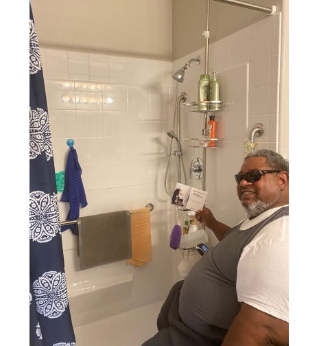 Mr Dickerson with his newly installed Freedom Shower