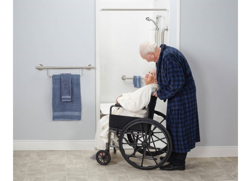 Wheelchair user approaching an ADA transfer shower