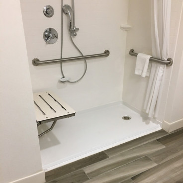 accessible shower pan for a hotel 