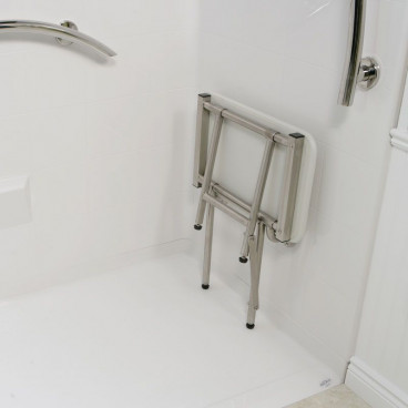 folding shower seat in up position