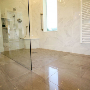 level entry tile over shower pan